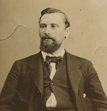 3 a man wearing a suit and tie