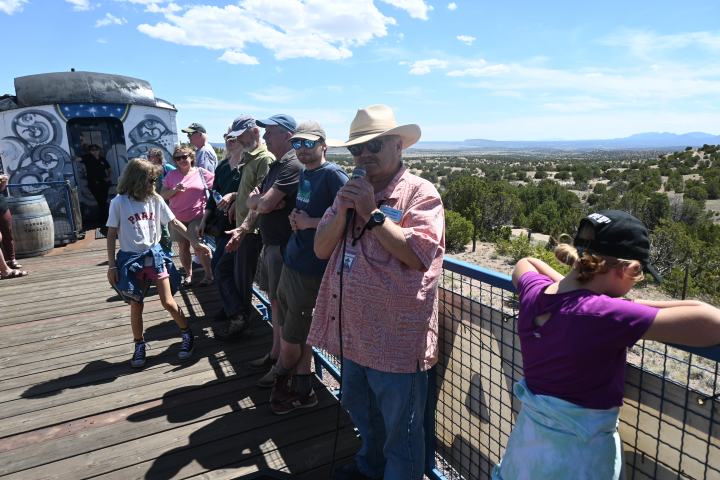 a group of people standing on top of a hill