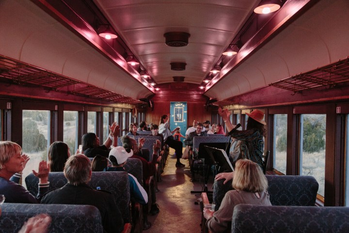 a group of people sitting at a train station