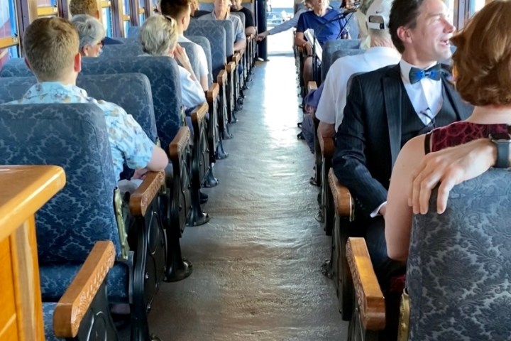 a group of people sitting at a train station