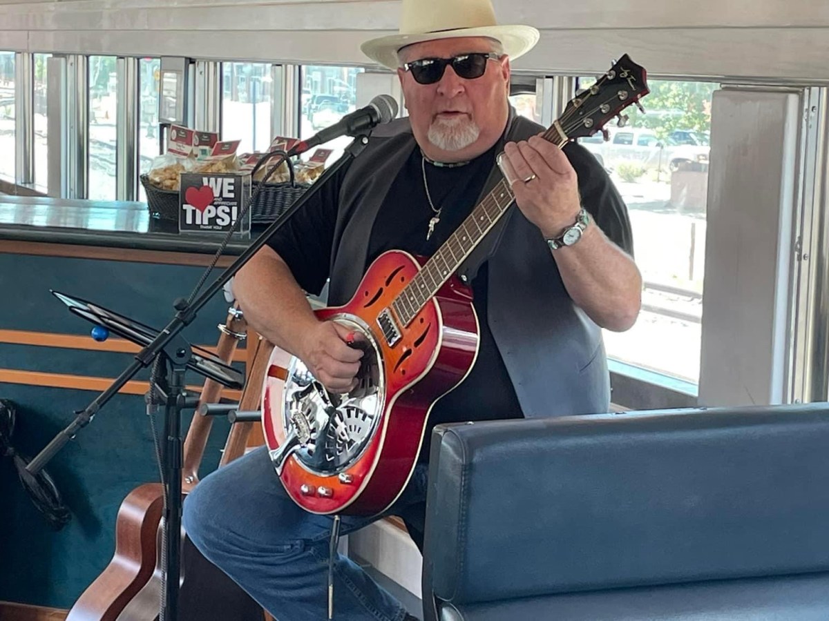 a person holding a guitar