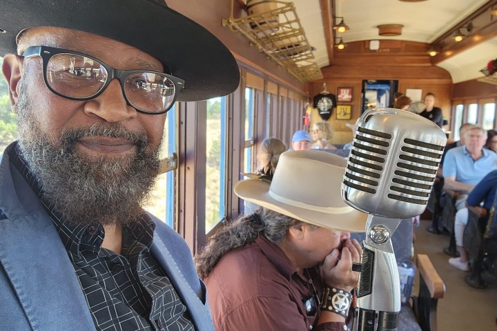 a man wearing a hat and glasses