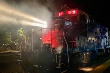 a train on the tracks at night