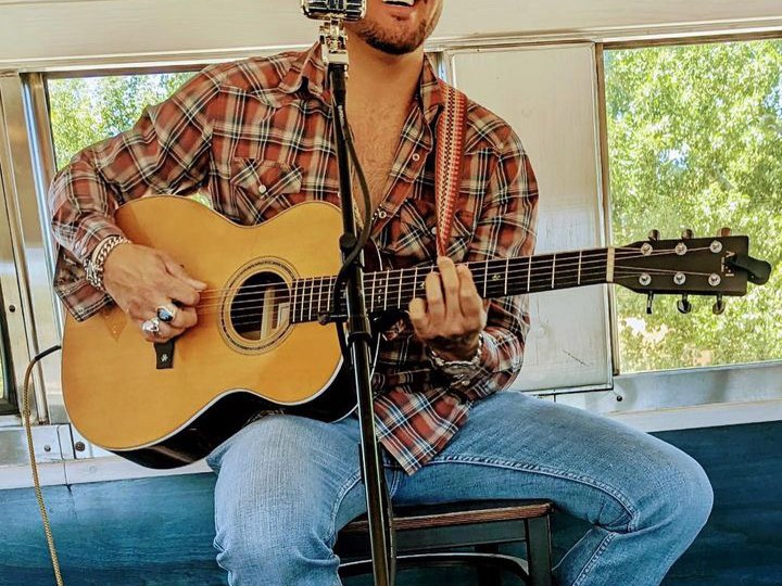 a person holding a guitar