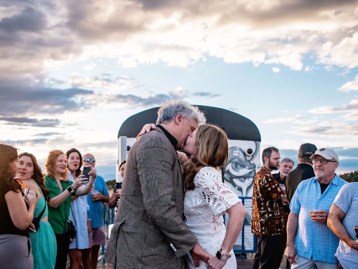 a group of people standing in front of a crowd