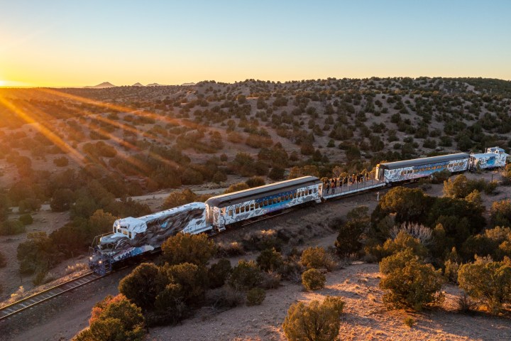 a train on a track with smoke coming out of it